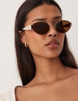 Gina Tricot – Sonnenbrille mit ovalem Metallrahmen in Gold mit braunen Gläsern