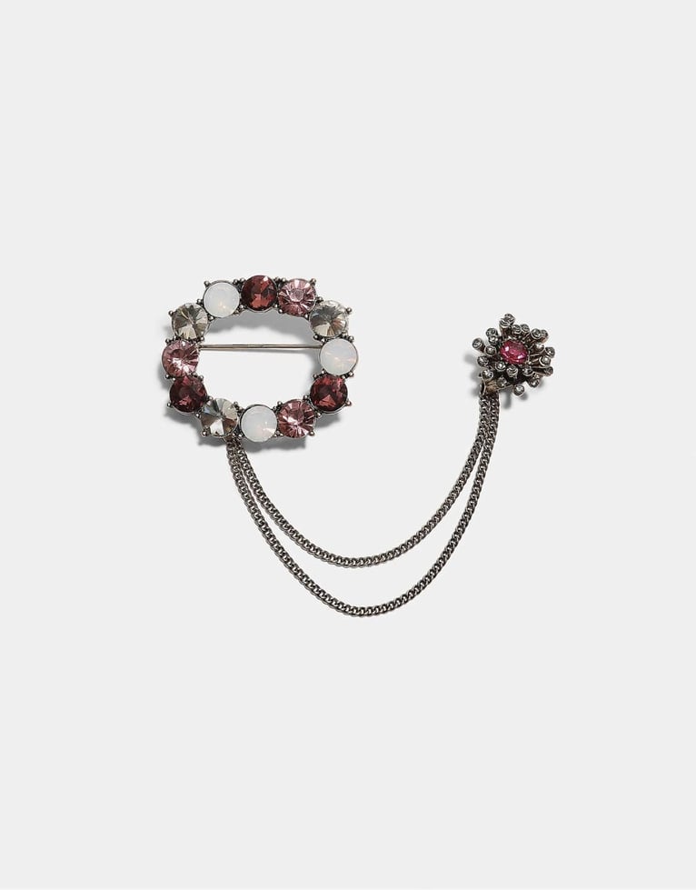 Stradivarius Brosche mit Schmucksteinkette in Gold