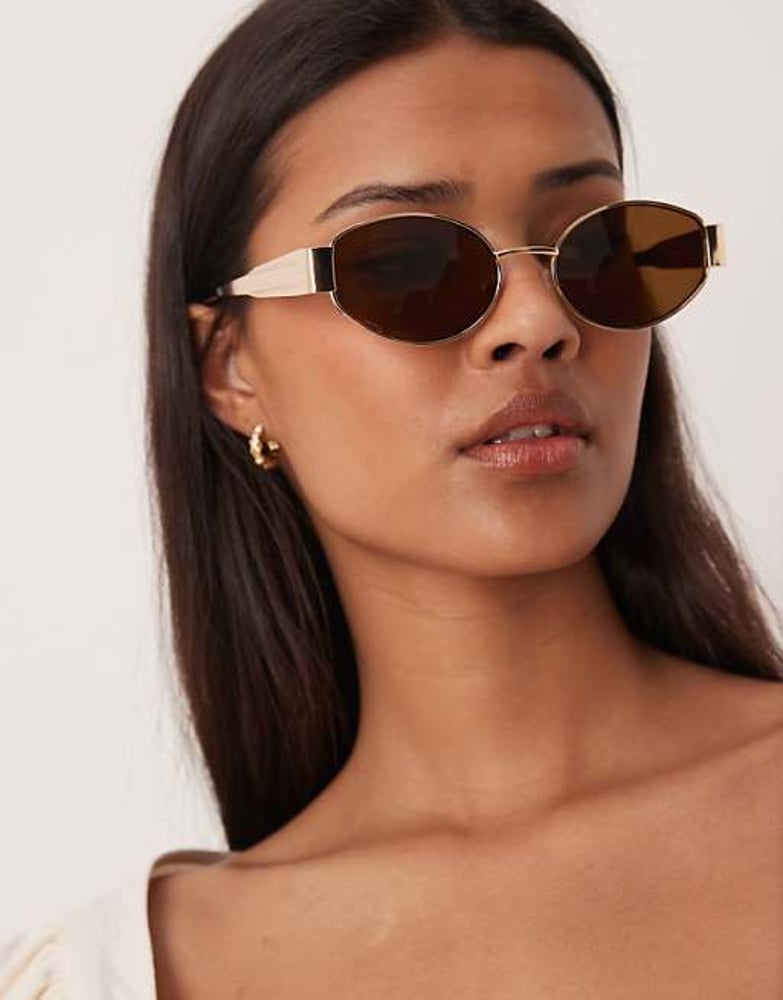 Gina Tricot – Sonnenbrille mit ovalem Metallrahmen in Gold mit braunen Gläsern